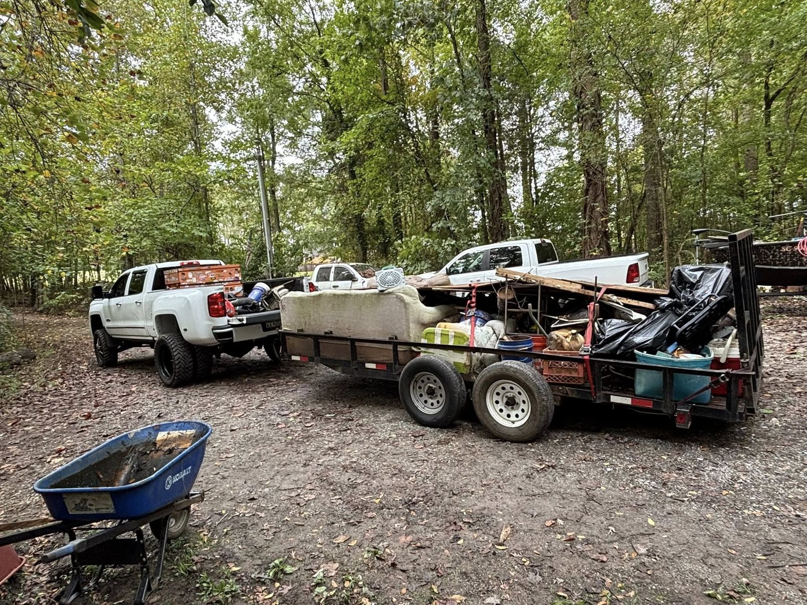 Two trucks with loaded trailers ready to haul