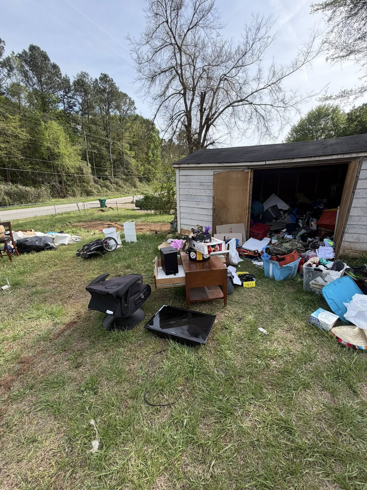 Shed cleanout with contents spread out