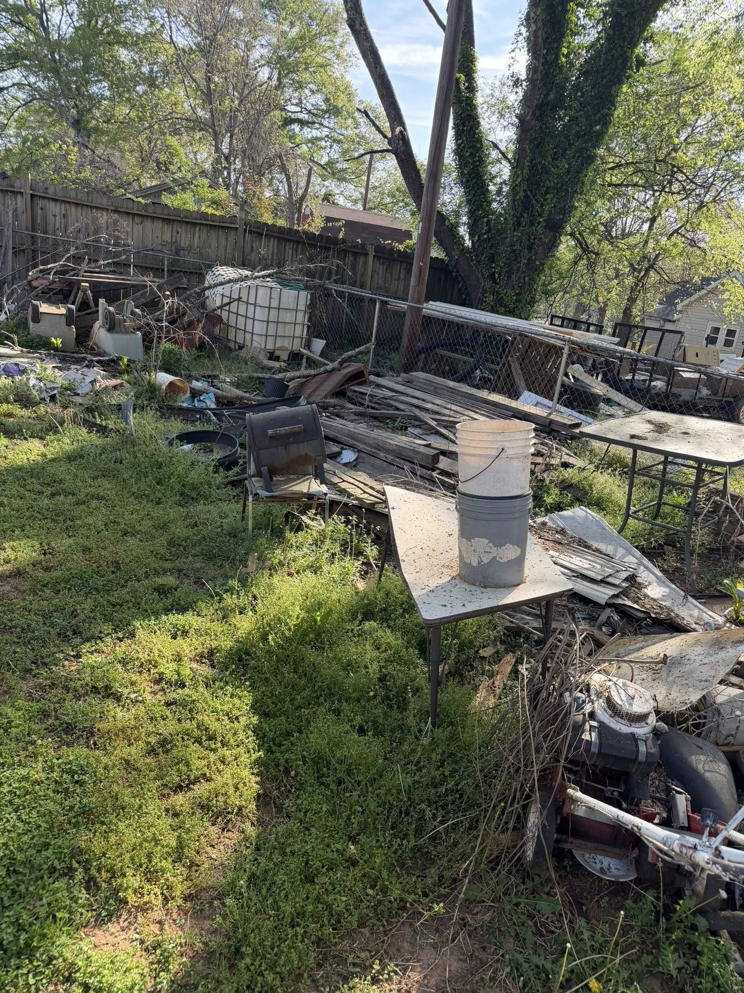 Property Debris Cleanout before junk removal by Coyles on Call