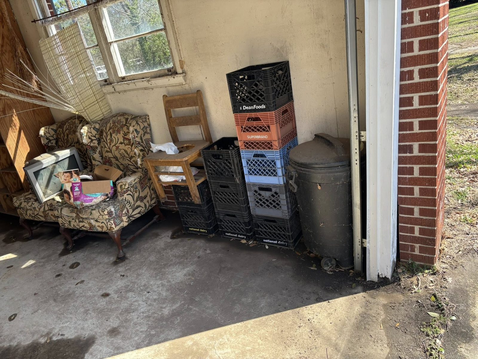 Indoor junk and furniture pile in garage bay