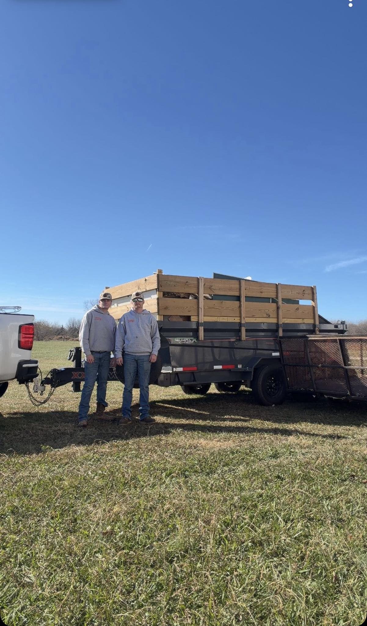 Mayson and Nate Coyle with loaded dump trailer
