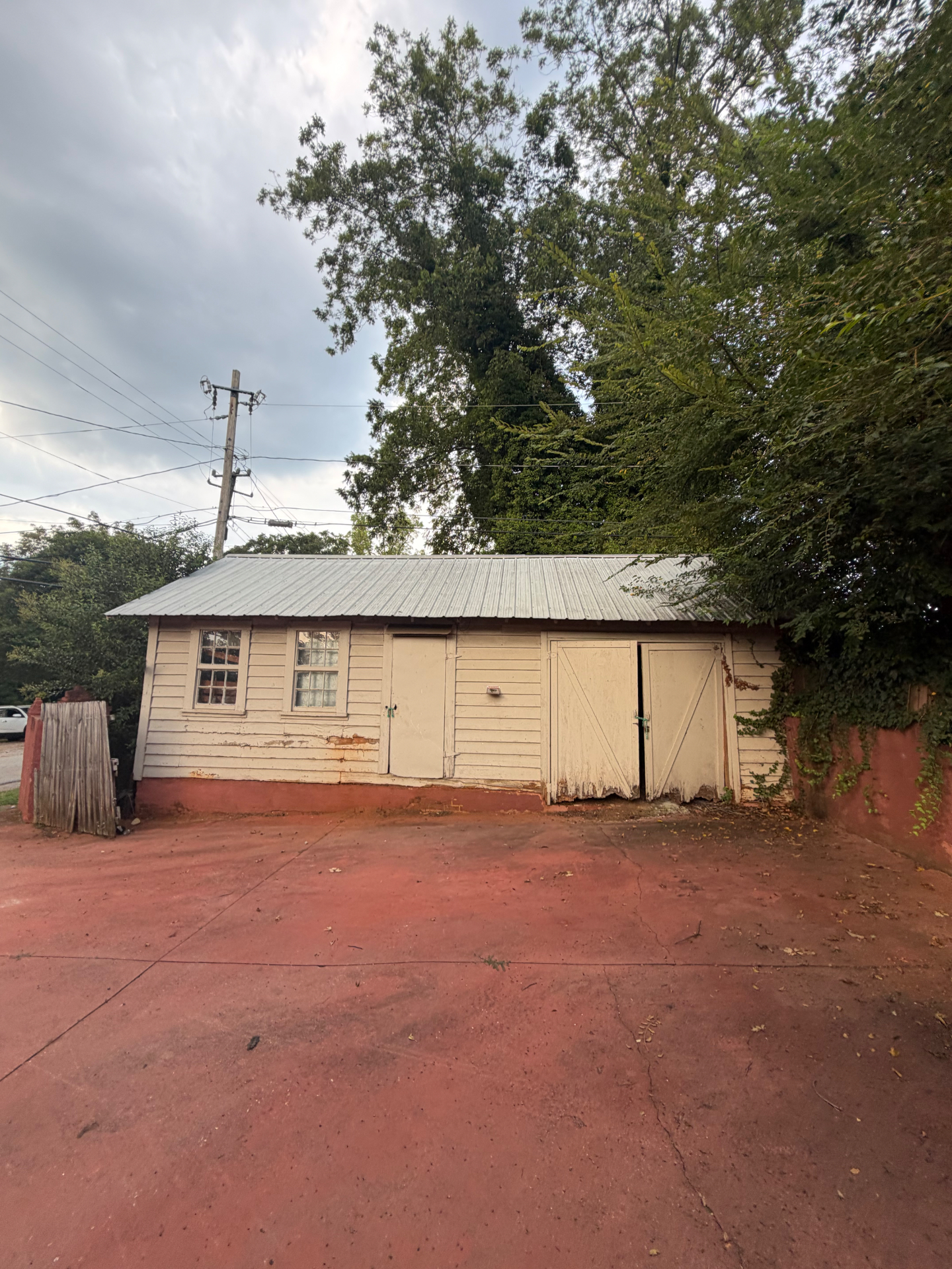 Garage and outbuilding site before demolition by Coyles on Call