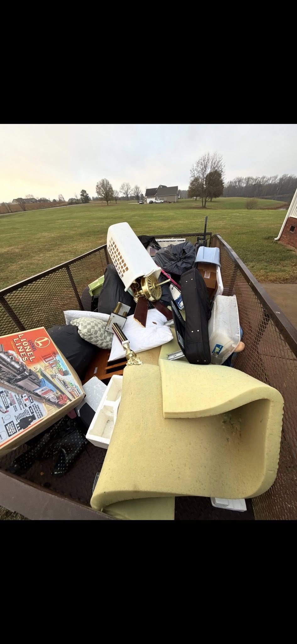 Trailer loaded with household junk