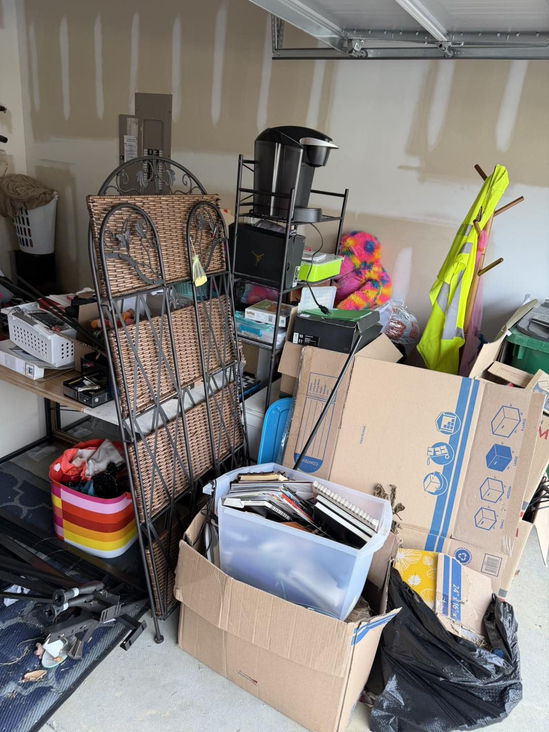 Cluttered garage with shelves and boxes