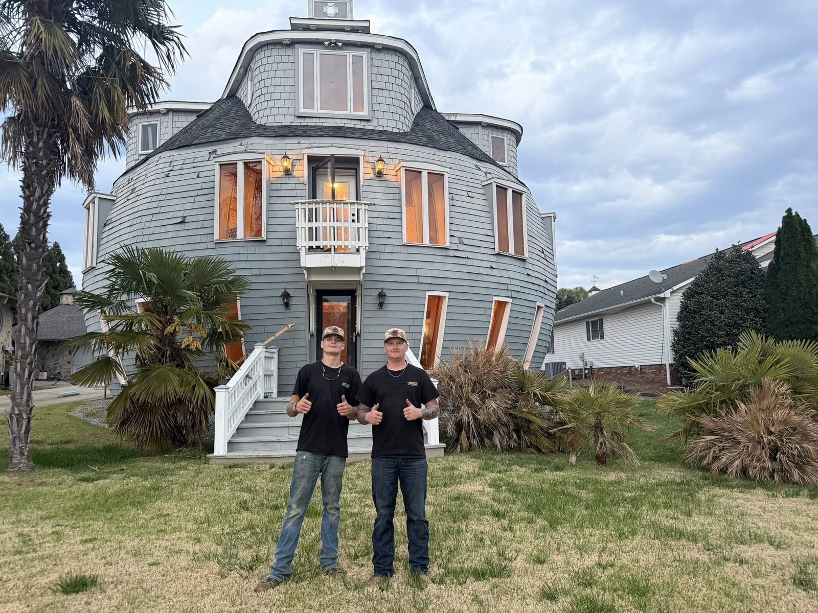 Mayson and Nate Coyle in front of unique round house